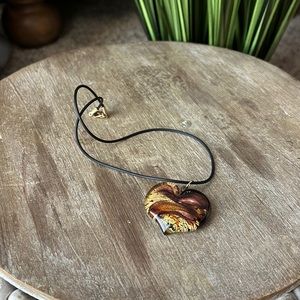 Beautiful heart necklace on a rubber like chain.